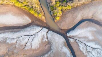 Aerial view of forest creek and textured landscape with frost patterns photo