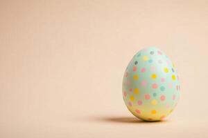 Colorful pastel easter egg with polka dot pattern for festive celebrations photo