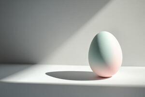 Pastel-colored egg in soft lighting creating a minimalist composition photo