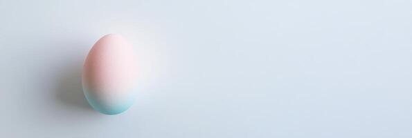 Pastel gradient egg on light background symbolizing simplicity and minimalism photo