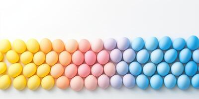 Colorful gradient of pastel easter eggs arranged in a perfectly aligned row photo