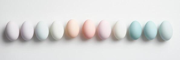 Elegant row of pastel colored eggs displaying subtle color variations and symmetry photo