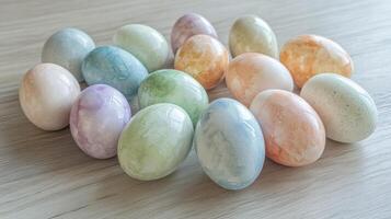 Assorted pastel-colored easter eggs arranged on wooden surface for decoration theme photo