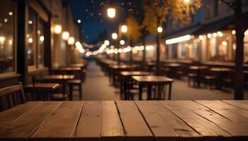 Empty wooden tables and chairs in a restaurant at night photo