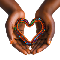 Hands adorned with a vibrant beaded bracelet create a heart shape symbolizing love and unity, African Hands with Beaded Bracelet Forming Heart Shape on transparent background png