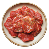 Seasoned raw beef slices arranged neatly on a plate, ready for culinary preparation in a kitchen setting, seasoned raw beef food on plate isolated on transparent background png