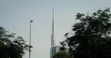 A tall building with a tall tower in the background video