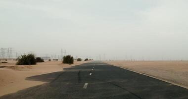 A desert road with power lines in the background video