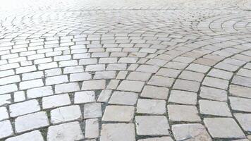 Exploring the unique cobblestone patterns in a lively city square video