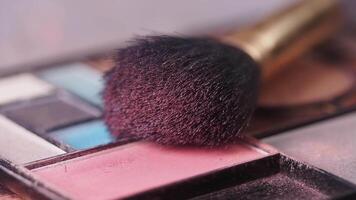 Demonstration of applying makeup using various colors and tools video