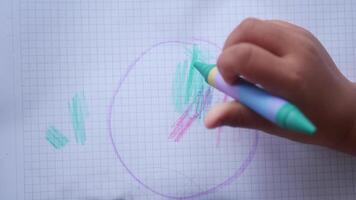 Child enjoys creative drawing with colorful markers in a sketchbook video
