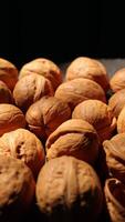 Walnut nuts food, closeup of walnut nut texture on black background, nuts video