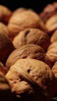 Walnut nuts food, closeup of walnut nut texture on black background, macro of walnut nut food video