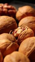 Walnut nuts food, closeup of walnut nut texture on black background, nut on black background, vertical of walnut nut food video