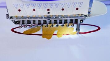 Embroidery machine in textile factory. Close up of computerized embroidery machines video
