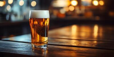 Amber Pint of Cold Frothy Beer on Wooden Table in Cozy Bar or Pub Setting photo
