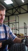 Tire store worker measuring tread depth with gauge video