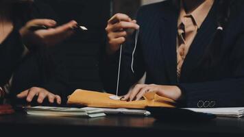 Two business women are working on a project together video