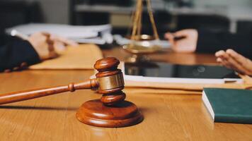 Judge gavel on wooden table with papers and books video