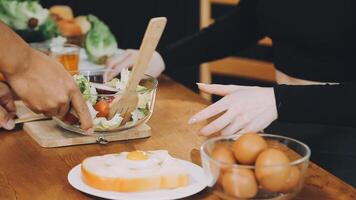 A woman is preparing a salad with eggs and vegetables video