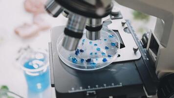Microscope with blue and white objects on top video
