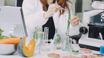 A woman in a lab coat is working on a project video