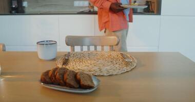 A man standing in front of a table with a plate of food video