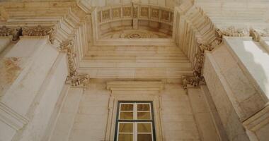 Overview inside the marble triumphal arch in classicism style, movement from bottom to top video