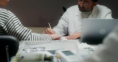 A doctor is talking to a patient video