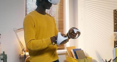 A man wearing a virtual reality headset in a room video