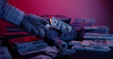 A man is holding a stack of money in front of a machine video