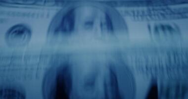A close up of a dollar bill with blurred background video
