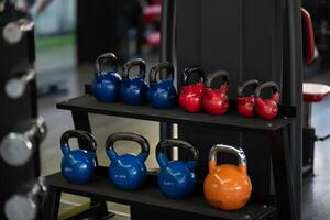 A pair of dumbbells neatly arranged in the gym, ready for a powerful workout session to build strength and endurance photo