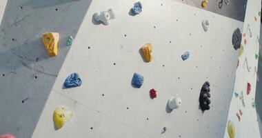 Shooting a Rock Climbing Wall with many irregularities and angles that simulate rocks and ledges, close-up without people. video