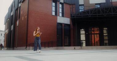 A woman walking in front of a building video