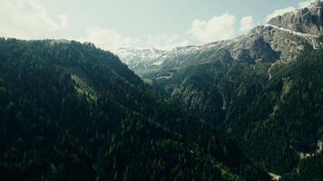 A mountain range with trees and a river video