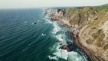 An aerial view of the ocean and cliffs video