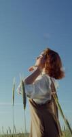 A woman in a field with wheat video
