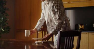 A man is standing in front of a table video