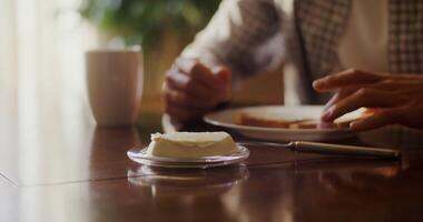 A man sitting at a table with a plate of food video