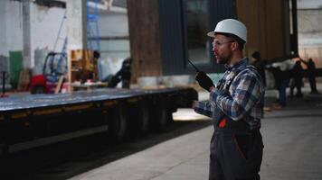 Construction supervisor managing modular home loading process video