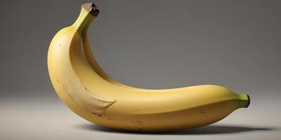 Close-up of Ripe Yellow Banana on Smooth Surface with Soft Lighting photo