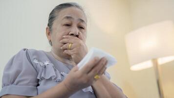 Patient suffering from pneumonia and coughing at risk of lung cancer is shocked to see bloody sputum. photo