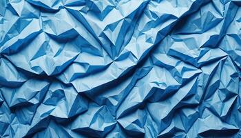 Abstract Crumpled Blue Paper Texture Background with Intricate Wrinkles and Geometric Patterns photo