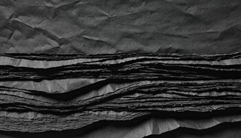 Close Up of Black Crumpled Paper Texture Abstract Monochrome Background photo