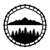 A stylized black and white circular emblem featuring a mountain range over a forest, within a gearlike border. vector