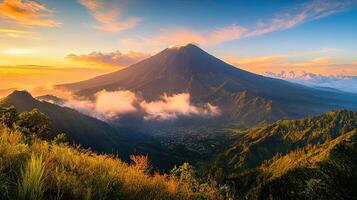 Lush Mountain Landscape at Golden Hour with Rolling Hills and Mist in a Tropical Destination photo
