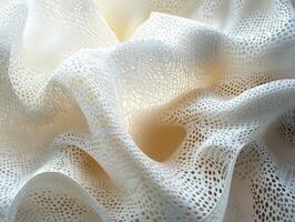 Delicate white fabric creating soft waves in natural light photo