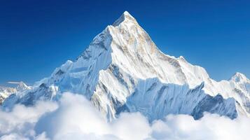 Majestic snow-capped mountain towering above fluffy clouds photo