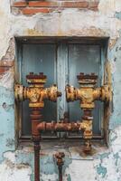 Leak pipe system on an aging building wall with rust photo